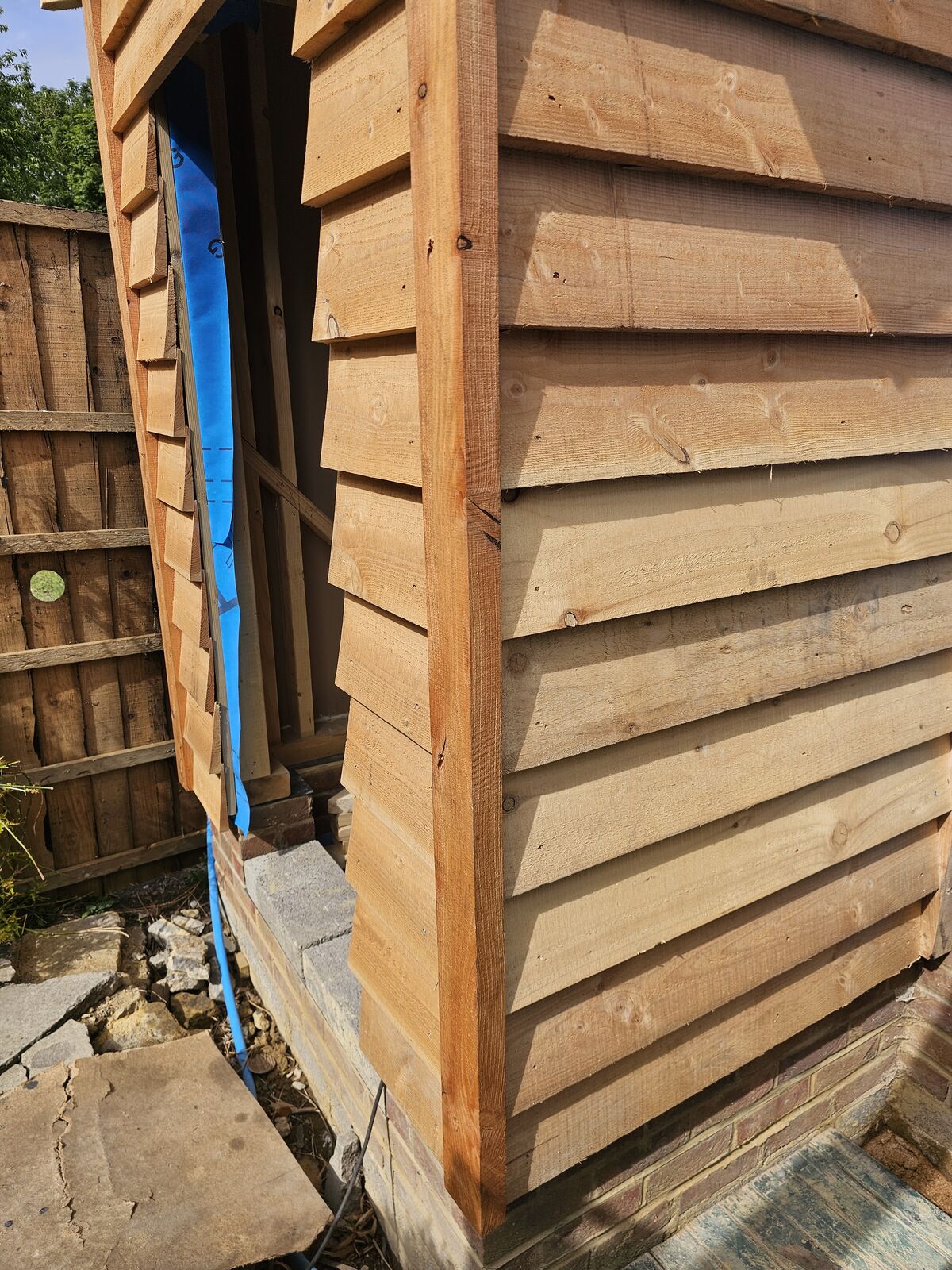 Lean-to roof with exposed oak rafters and boarding over the top